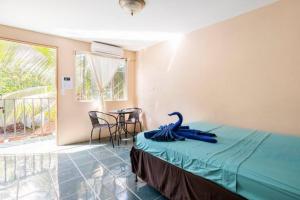 Postel nebo postele na pokoji v ubytování Habitación Privada - Apartamentos Morpho CR