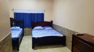 Postel nebo postele na pokoji v ubytování Habitación Privada - Apartamentos Morpho CR