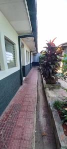 a brick walkway in front of a building at Casa 25 hostal in Santa Ana