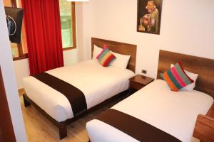Postel nebo postele na pokoji v ubytování Inti Pacha Palace Machupicchu