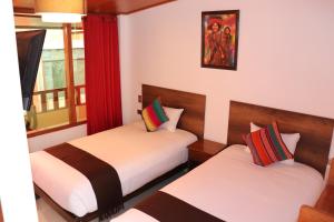 Postel nebo postele na pokoji v ubytování Inti Pacha Palace Machupicchu