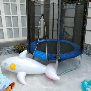 a toy pig shaped play tent with a trampoline at Two pools private villa for families. in Qaryat Shākūsh
