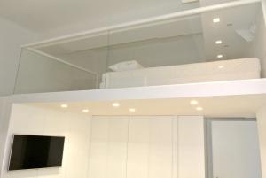 A television and/or entertainment centre at Duomo Inn