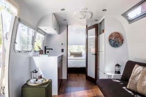 a tiny house with a kitchen and a living room at AutoCamp Sequoia in Three Rivers