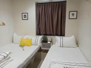 Letto o letti in una camera di Sun Guest House