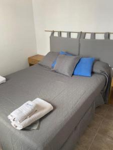 Säng eller sängar i ett rum på Marina Azul