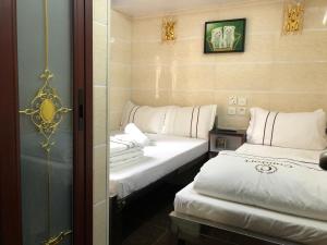 Letto o letti in una camera di Sun Guest House