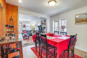a dining room with a red table and chairs at Dog-Friendly Michigan City Home - 3 Mi to Beach! in Michigan City