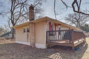 a small house with a porch and a chimney at Dog-Friendly Michigan City Home - 3 Mi to Beach! in Michigan City