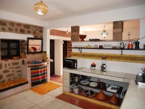 a kitchen with a stove top oven in a room at House of dreams in bin el ouidane in Bine el Ouidane