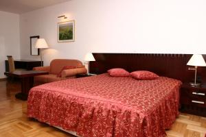 
A bed or beds in a room at Apartmani Marbis
