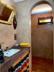 a bathroom with a sink and a mirror at House of dreams in bin el ouidane in Bine el Ouidane
