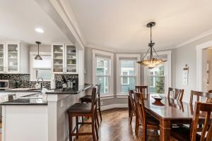 a kitchen and dining room with a table and chairs at Plymouth Paradise in Plymouth