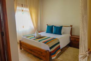 Postel nebo postele na pokoji v ubytování Hotel Gran Sirius