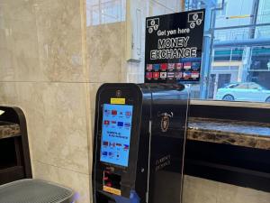 a money exchange machine in front of a building at Toyoko Inn Osaka Namba Nippombashi in Osaka