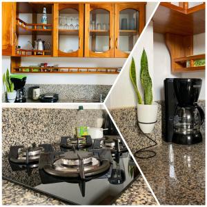 a kitchen with a stove top oven in a counter at Departamento Raya in Puerto Ayora +11 photos