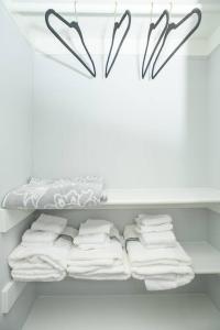 a closet with white towels on a shelf at BayRidge house by Quiet Waters, Thomas Point Parks in Annapolis