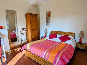a bedroom with a bed and a large mirror at Gîte accueillant 10 pers avec terrasse, proche nature, idéal pour famille et PMR à Mécrin - FR-1-585-12 in Mécrin