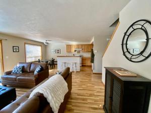 a living room with a couch and a table at Three Peaks Retreat in Sisters