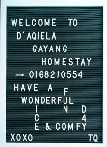a sign that says welcome to at D'Aqiela Gayang Homestay in Tuaran