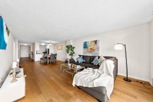a living room with a couch and a table at The tulip Marina Highrise with ocean view in Los Angeles +64 photos