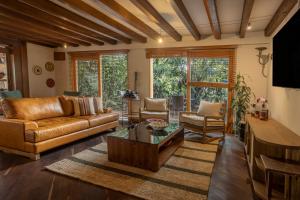 a living room with a couch and a table at Sazagua Hotel Boutique in Pereira