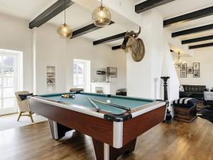 a living room with a pool table in it at 20 person holiday home in Svendborg in Svendborg