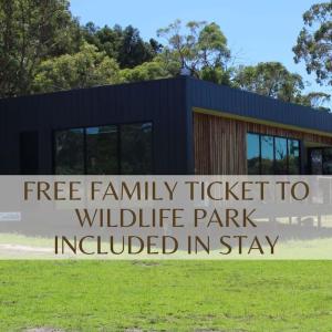 a building with the words free family ticket to wildlife park included in stay at Softfoot Farm Luxury Retreats in Hindmarsh Valley