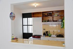 a kitchen with a sink and a counter top at Casa completa a 5 minutos de la playa en Crucecita Huatulco in Santa Cruz Huatulco