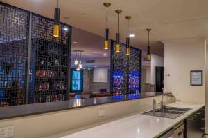 a kitchen with a bar with a wine rack at Best location in the CBD; pool, gym, rockclimbing +7 other amenities in Melbourne