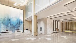 a lobby of a building with a large window at Courtyard by Marriott Shanwei Haifeng in Shanwei