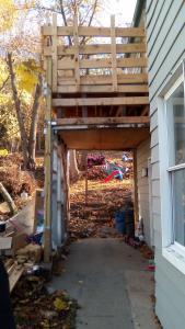 a wooden pergola on the side of a house at Peaceful Mountain Home in West Homestead