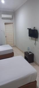 Voodi või voodid majutusasutuse Planters Guest House toas