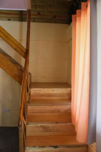 a staircase in a sauna with wooden floors at Villa Raynell in Constanza