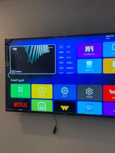 a flat screen tv sitting on top of a wall at RAAK HOTEL فندق راك in Siwa