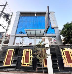 a tall building with a black and yellow door at JD Grand Inn in Guwahati