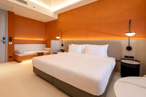 Postel nebo postele na pokoji v ubytování Hotel Adam Krabi