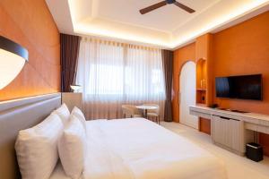 TV a/nebo společenská místnost v ubytování Hotel Adam Krabi