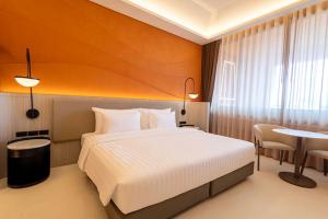 Postel nebo postele na pokoji v ubytování Hotel Adam Krabi