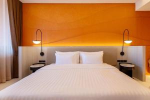 Postel nebo postele na pokoji v ubytování Hotel Adam Krabi