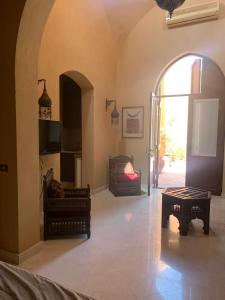 a living room with an archway and a room with a couch at Nubia Gouna in Hurghada