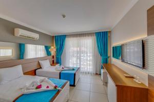 Postel nebo postele na pokoji v ubytování Marcan Resort Hotel + 29 fotografií