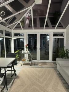 a living room with a couch and a table at Angmering Home in Angmering