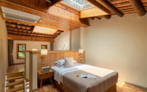 a bedroom with a bed in a room with wooden ceilings at Moon Villa in Yangshuo