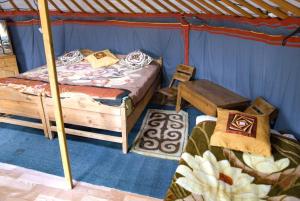 a bedroom with two beds in a tent at Nature Door Resort, Khuvsgul province, Mongolia 