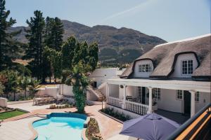 an aerial view of a house with a swimming pool at Mirabelle Guesthouse in Franschhoek