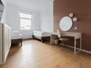 Posteľ alebo postele v izbe v ubytovaní VacationClub – Aleja I Armii Wojska Polskiego 6