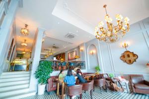 Khu vực ghế ngồi tại Di lusso Boutique Hotel Riverside Danang