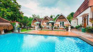 a swimming pool in front of a house at Penida Hills in Nusa Penida