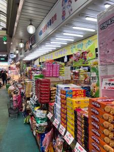 a grocery store aisle with a lot of food at Ho Home Tel in Seoul